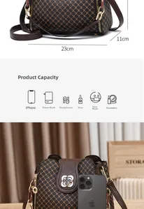 Detailed view of brown crossbody bag showing 23cm width and daily capacity layout