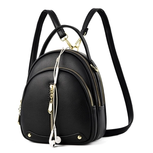 Classic black mini backpack in lychee texture faux leather with gold hardware and zipper