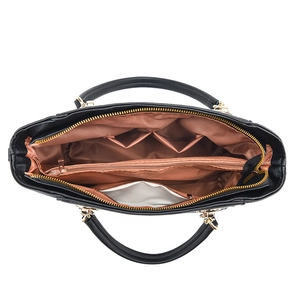 Black PU leather tote bag with interior compartments and gold metal hardware