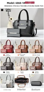 Detailed size view of the glossy faux leather handbag with crocodile pattern texture