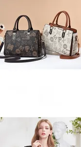 Detail view of printed tote bag with MFX lettering and adjustable leather straps