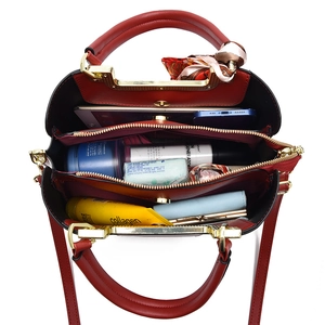 Red PU leather tote bag with gold handles and multi-compartment interior for women