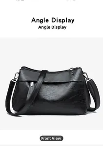 Front view of black soft leather crossbody bag with detailed lychee texture and zipper