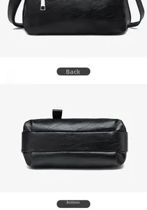 Detail view of the black leather bag back and base featuring classic lychee grain texture