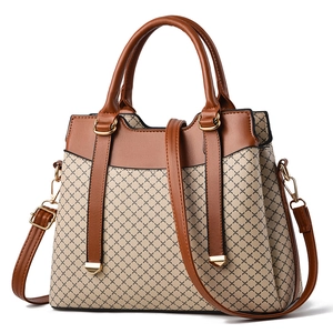 Elegant beige and brown geometric print handbag with top handle and adjustable strap