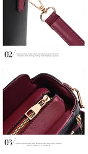 Détail d'un sac en cuir noir avec ferrures dorées et coutures de bordure rouges