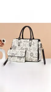 Close-up of vintage beige tote bag with leopard print lettering and reinforced hardware
