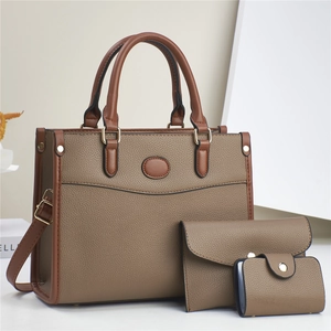 Three-piece earth tone tote bag set with wallet and card holder in premium textured leather