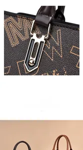 Detail of elegant tote bag featuring monogram print and geometric gold hardware