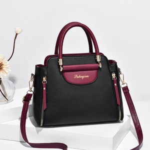Sac à main élégant pour femme en cuir noir et rouge avec bandoulière réglable chic