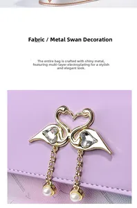 Close-up of golden swan metal lock with heart crystal and pearl on purple leather bag