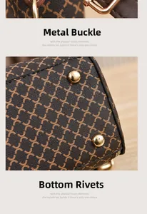 Detail of brown PU handbag featuring golden clasps, reinforced rivets and X-pattern