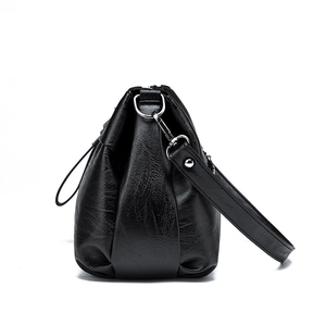 Minimalist black pebbled leather crossbody shoulder bag with silver hardware for women