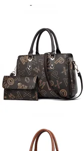 Detail view of coffee monogram handbag and matching long wallet with adjustable strap