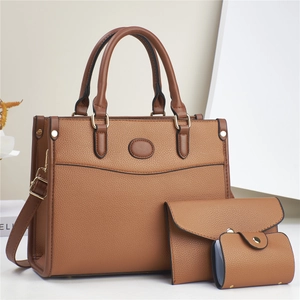 Three-piece brown pebble leather tote bag set with matching wallet and card holder