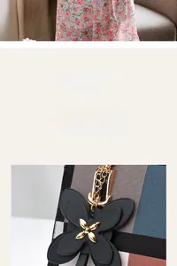 Detailansicht der schwarzen gesteppten Ledertasche mit Metallkette und Seidenschal-Akzent