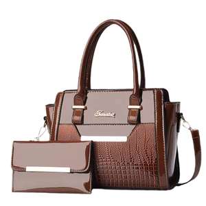 Dark brown faux crocodile patent leather tote bag set with matching long wallet on white background
