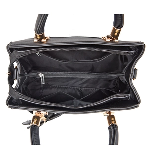 Top view of large capacity black leather tote showing three internal compartments and gold zippers
