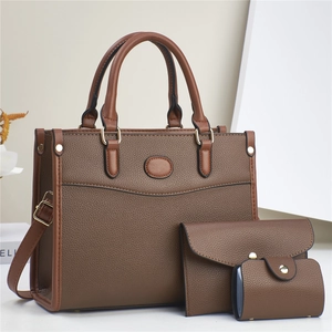 Three-piece brown pebbled leather tote bag set with envelope pouch and coin purse