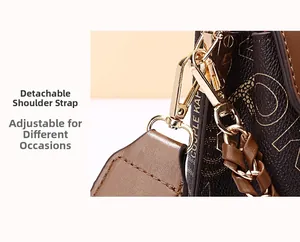 Close-up of detachable gold buckles and woven leather strap on a brown crossbody bag