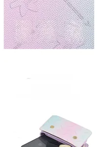 Detail of a purple textured leather crossbody bag showing internal storage capacity
