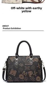 Detail of printed tote bag with leather texture and adjustable shoulder strap