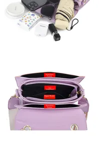 Internal structure of purple crossbody bag showing main pockets and large capacity