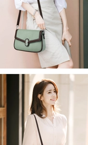 Detailed macro of a green crocodile embossed crossbody bag with leather strap and lock