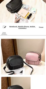 Three-zipper compartments detail showing storage capacity with wallet and phone