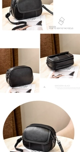 Detail of black pebbled leather crossbody bag with white contrast stitching and multi-zippers