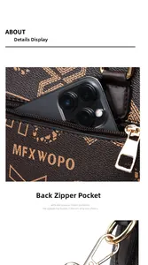 Detail of the back zipper pocket on a brown monogram tote bag holding a smartphone