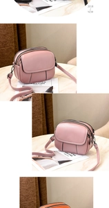 Detail view of pink leather crossbody bag with multiple zippers and quilted stitching
