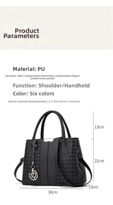 Detailed view of black PU handbag with woven texture and heart-shaped pendant dimensions