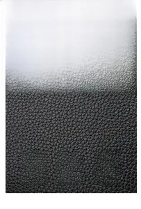 Macro view of soft black cowhide leather texture for high-capacity tote bag