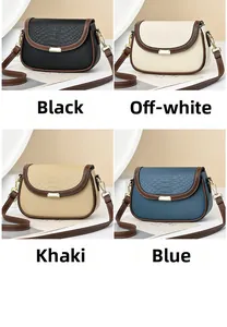 Detail view of small square bags in black, white, khaki, and blue with faux snake skin flap