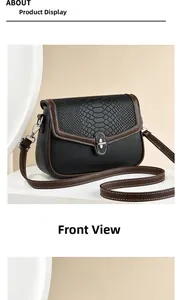 Detail of crossbody bag featuring snakeskin texture flap and silver metallic twist lock