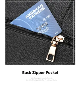 Close-up of functional rear zipper pocket on black lychee texture leather handbag
