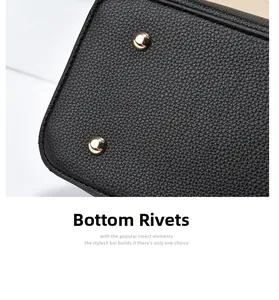 Macro shot of durable gold-tone metal bottom studs on a black pebble leather handbag