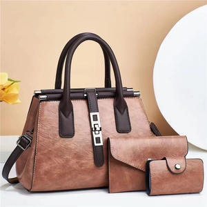 Three-piece set of brown PU leather tote bags including clutch and coin purse