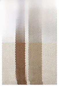 Close-up of textured striped woven fabric detail showing beige and brown material texture