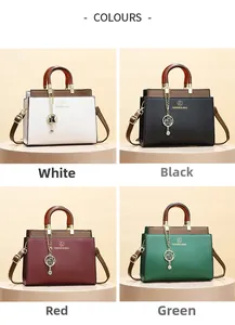 Detail of color-blocked leather handbags in four colors with cat silhouette pendants