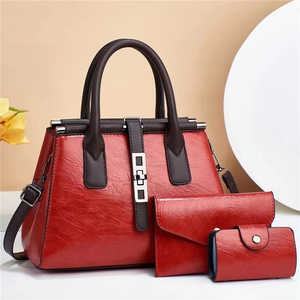 Three-piece women's handbag set featuring red oil wax leather and large shoulder tote