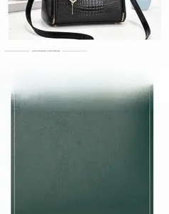 Close-up of black crocodile pattern and dark green pebble grain leather bags with gold hardware