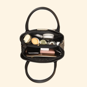Black leather tote bag for women featuring multiple internal compartments and gold hardware