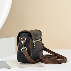 Vintage two-tone leather crossbody bag with lychee texture and gold-tone hardware detail