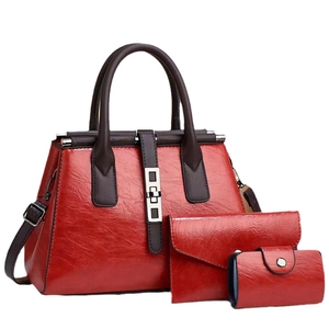 Three-piece red PU leather handbag set with shoulder strap and metal buckle accent
