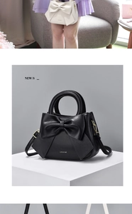 Detailed view of fashionable handbag with large decorative bow and premium metal hardware