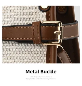 Close-up of woven fabric and brown leather strap with golden metal buckle and stitching