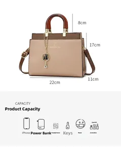 Internal capacity view of bicolor tote bag with size dimensions and daily essentials