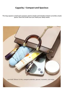 Spacious interior of two-tone handbag holding a phone, umbrella and cosmetics